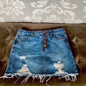 An adorable ripped denim skirt